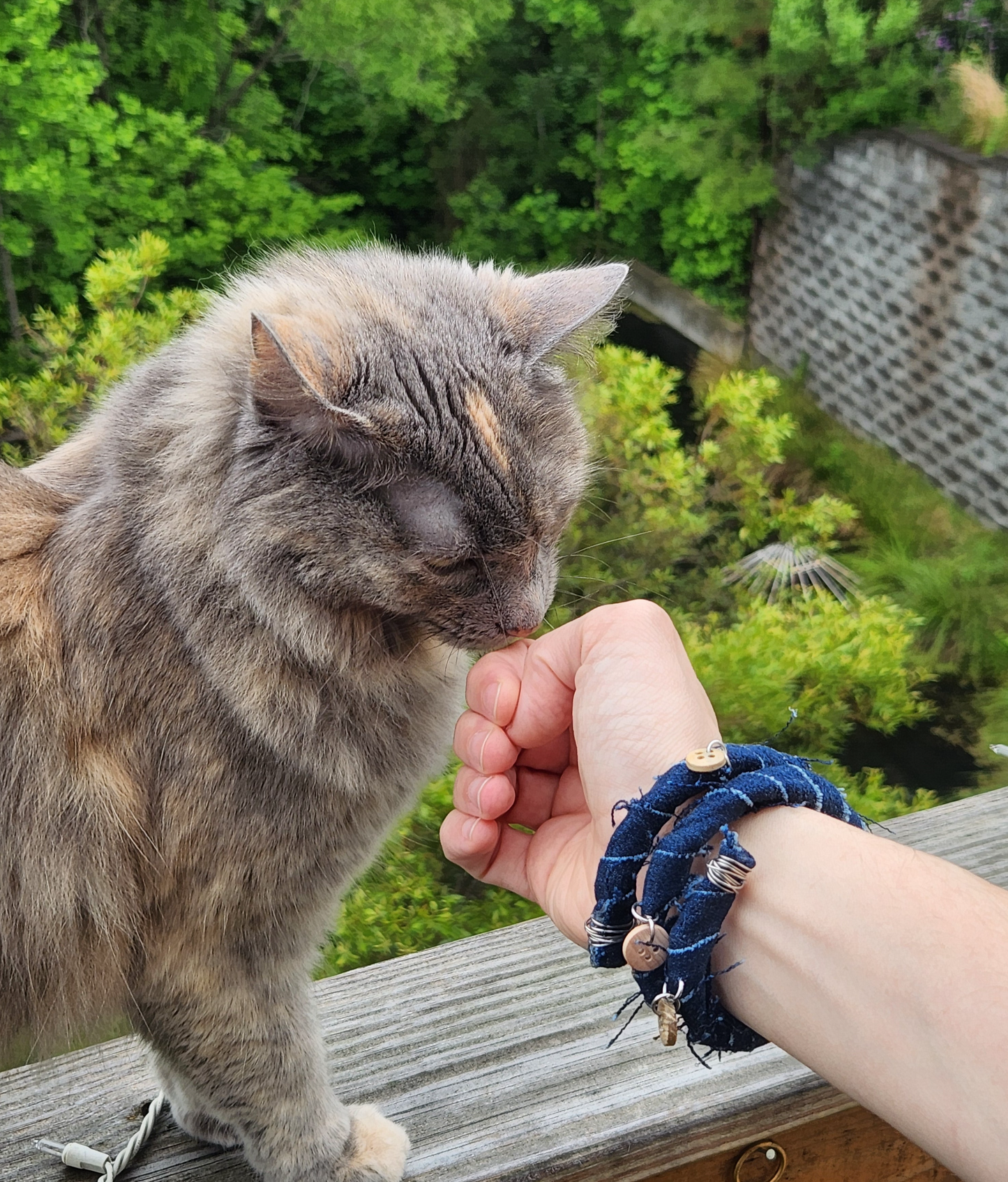 Denim wrap bracelet with wooden button dangles